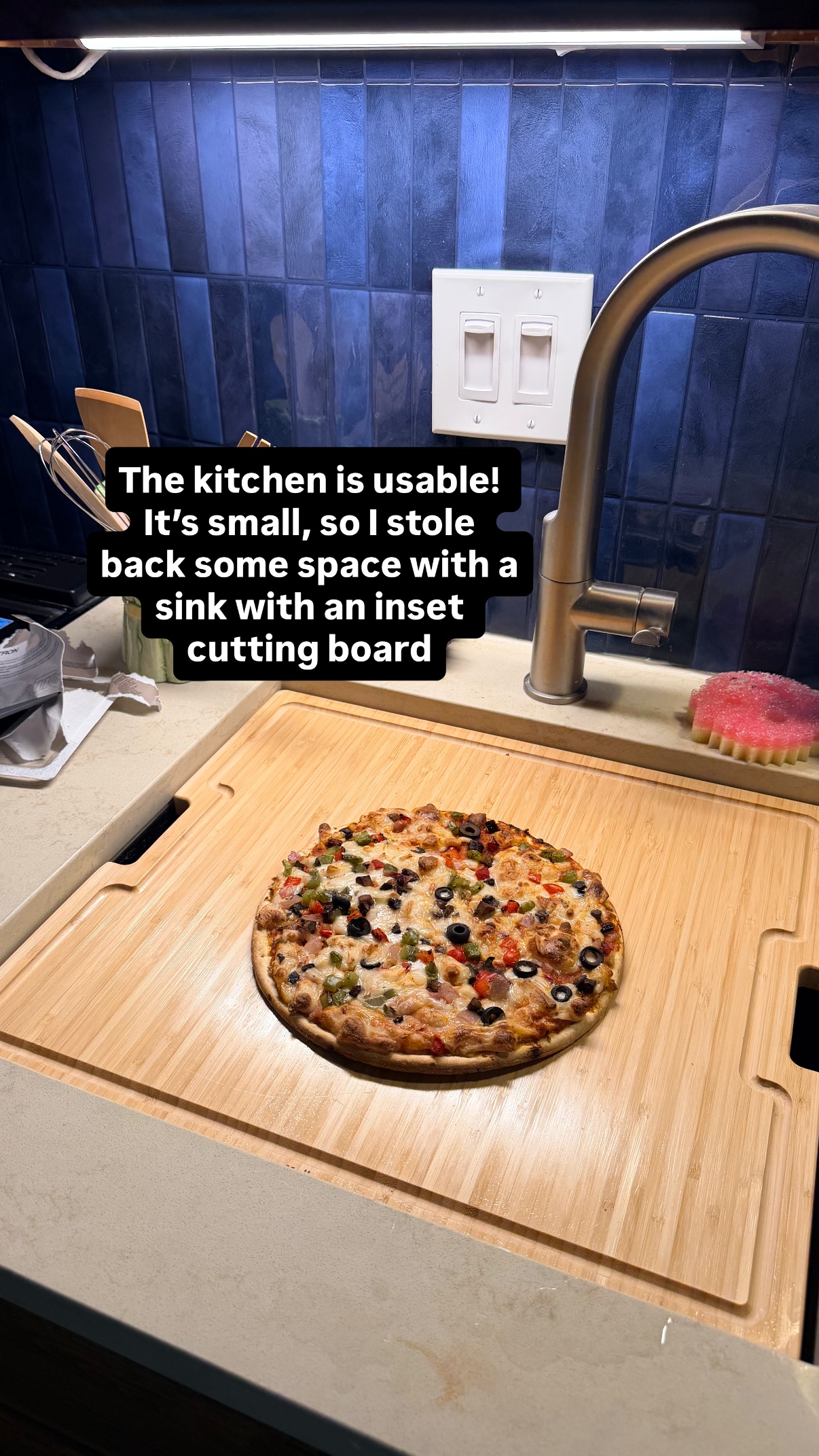 The kitchen is usable! It’s small, so I stole back some space with a sink with an inset cutting board